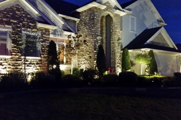 Illuminated home with AMP® Path Lights & Spotlights