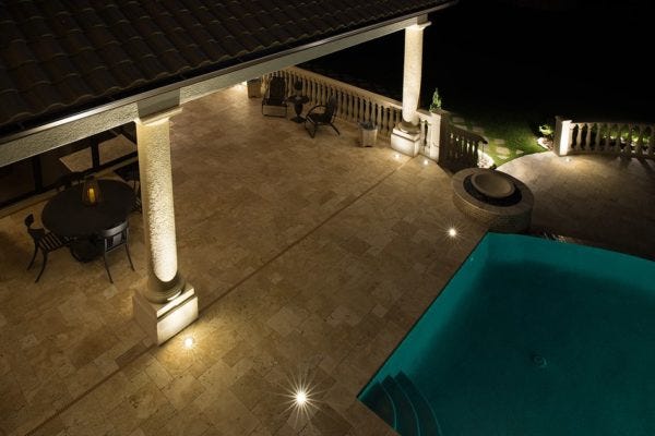 Illuminated pool patio with AMP® Well Lights & Spotlights