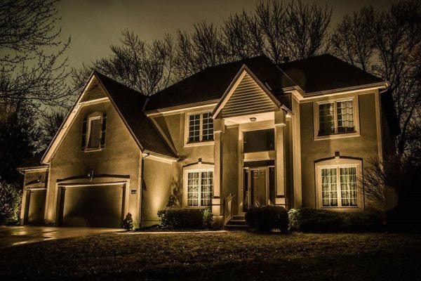 Illuminated home with AMP® Well Lights & Spotlights