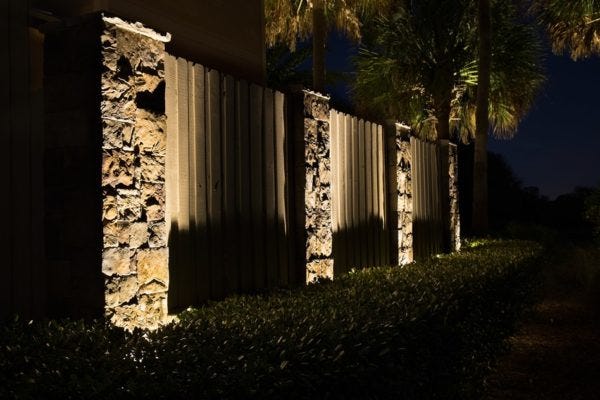 Illuminated fence with AMP® Spotlights