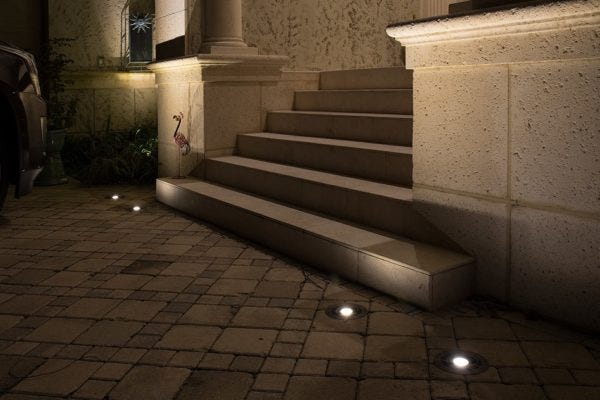 Illuminated front entryway with AMP® Well Lights