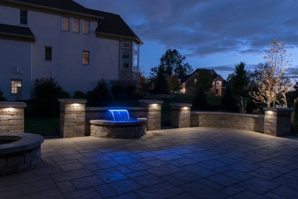 Illuminated paver patio with AMP® Hardscape Lights